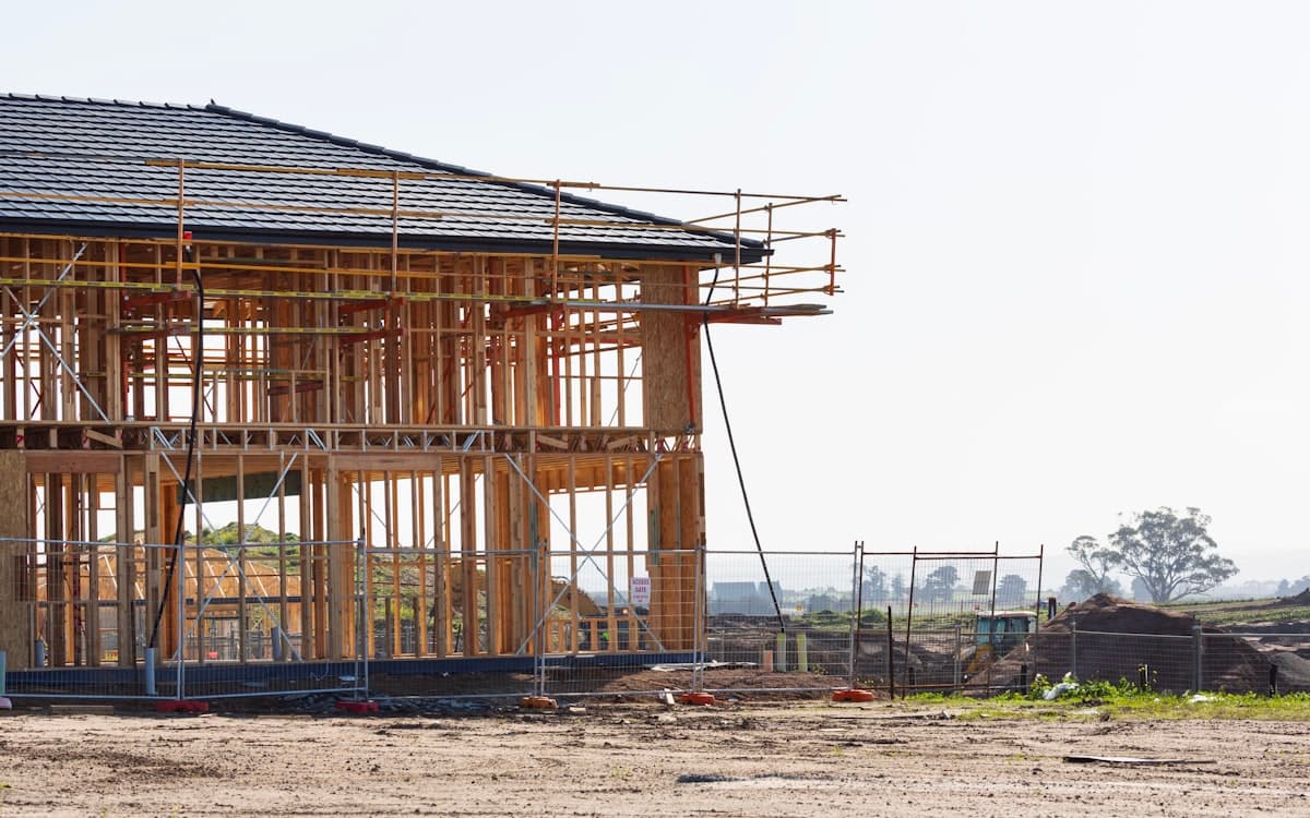 Two-storey timber-framed home extension under construction