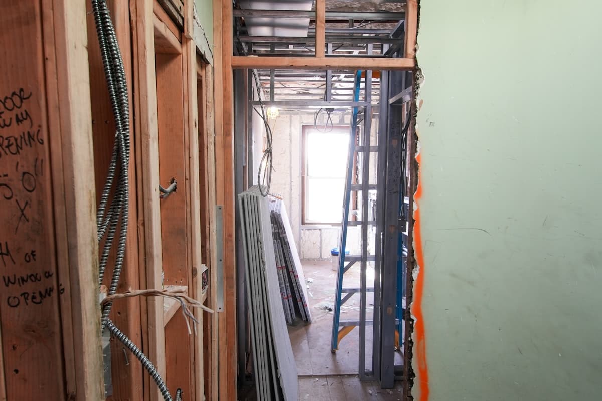 Interior hallway opened to the studs during a gut renovation